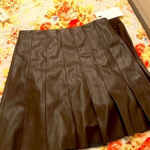 Y2K / 90s style brown leather pleated skirt.